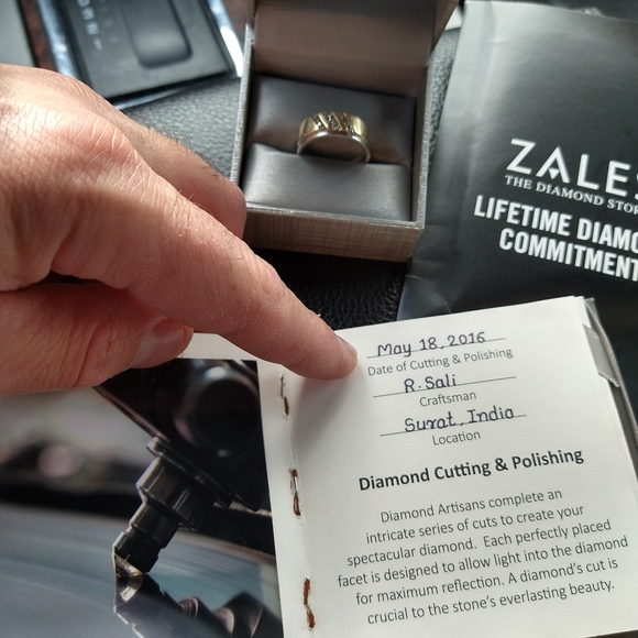 An engagement ring and man's wedding band . - Picture 3 of 10